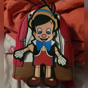 Pinocchio loungefly bag and wallet set